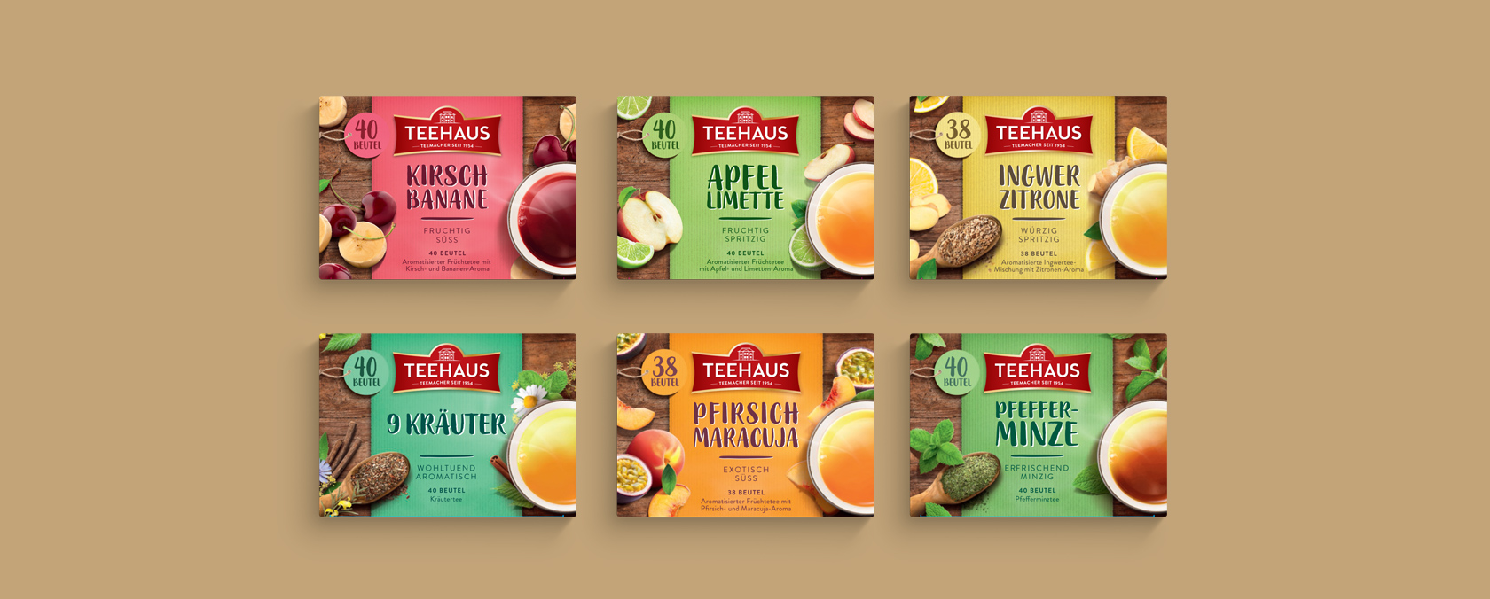 Sechs leuchtende Teehaus-Teeboxen mit Frucht- und Kräutermotiven, zweireihig auf beigem Hintergrund.