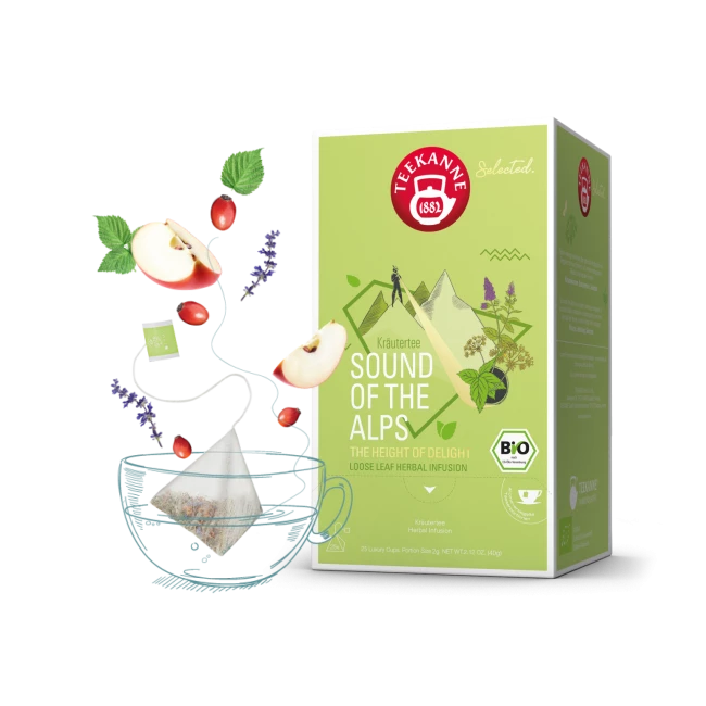 Teekanne Alpenklang Kräuterteebox mit Teetasse und schwimmenden Apfelscheiben, Kräuter.